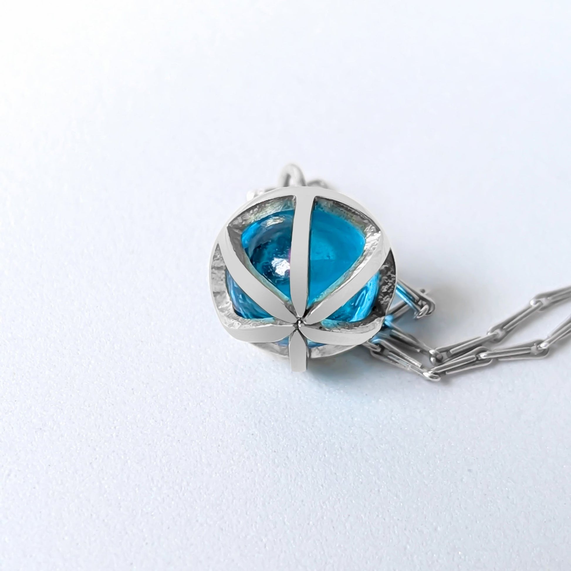 Detail of the cage of Drop of the Ocean Necklace - Fairtrade 9 Carat White Gold & Swiss Blue Topaz Sphere Necklace by Booblinka Jewellery