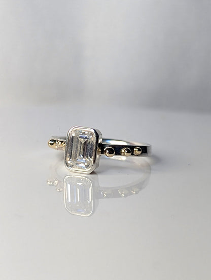 Emerald-Cut Moissanite and Gold Accent Ring from DEI Collection by Booblinka Jewellery