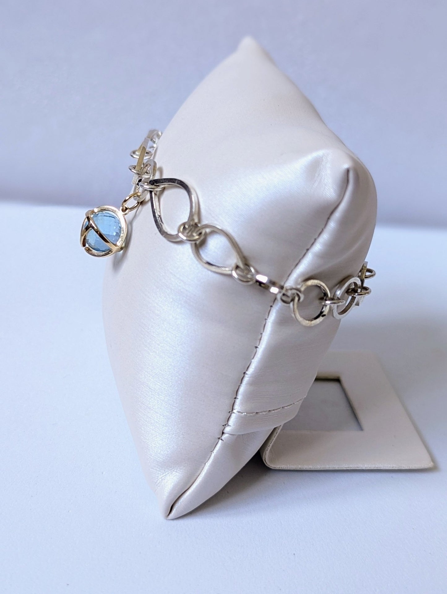 Side view of Sterling Silver Link Bracelet with Sky Blue Topaz Charm - Drop of the Ocean Collection by Booblinka Jewellery